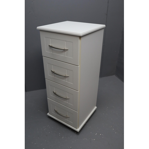 713 - White Four drawer chest with brushed steel handles on casters measures 39