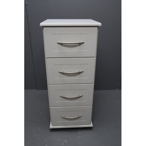 713 - White Four drawer chest with brushed steel handles on casters measures 39