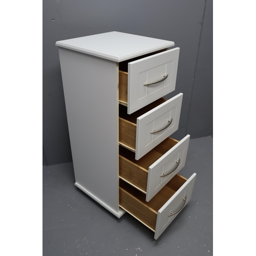 713 - White Four drawer chest with brushed steel handles on casters measures 39