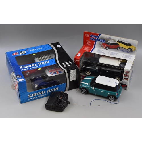 813 - Mini Cooper lot to include a friction motor with lots of moving parts and two remote control Mini Co... 