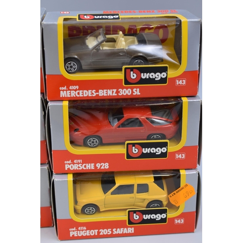 822 - 6 Burago die-cast model cars including a Ferrari f40, Mercedes Benz 190, Peugeot 205 safari, Porsche... 