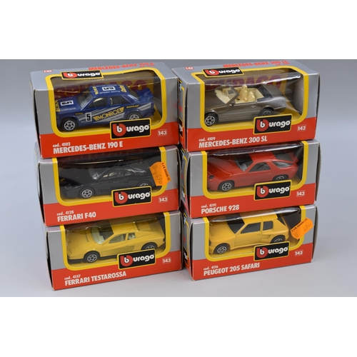 822 - 6 Burago die-cast model cars including a Ferrari f40, Mercedes Benz 190, Peugeot 205 safari, Porsche... 