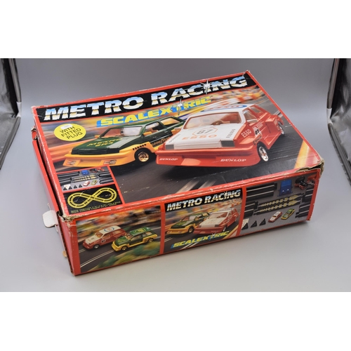 886 - Metro Racing Scalextric with plug fitted, seems to be complete with two extra cars and has a brand-n... 