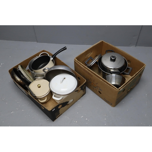 917 - Two boxes full of kitchen items to include saucepans, pans and more