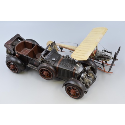 326 - Large tin plate model of a motor car and aeroplane (biggest L 15