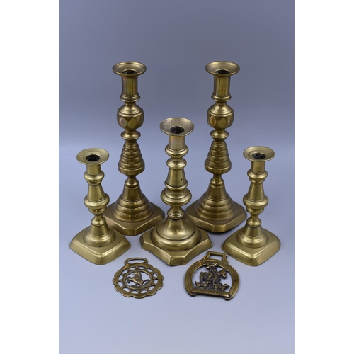 332 - A Selection of Brassware To Include Five Candlesticks, And Two Horse Brasses. Tallest Approx 11