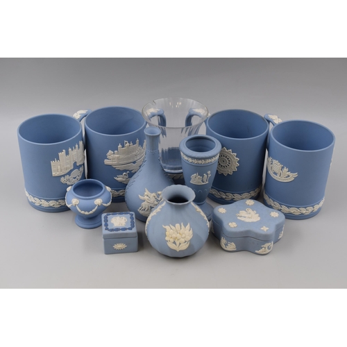 310 - Eleven pieces of Wedgwood Jasperware including 4 Tankards, Vases, and Trinket Dishes