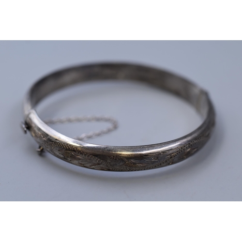 62 - Hallmarked Birmingham Silver Bangle complete with Safety Chain