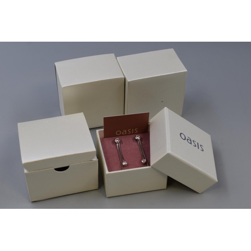 84 - Three Pairs of Pink Stoned Dangly Earrings in Presentation Boxes