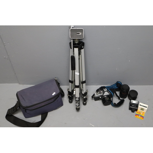 474 - A Praktica MTLS Camera, With Camera Bag, Three Lenses, Flash Unit, Film, And Tripod