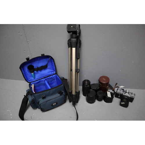 475 - A Zenit-E Camera With Camera Bag, Five Lenses, Tripod, And More