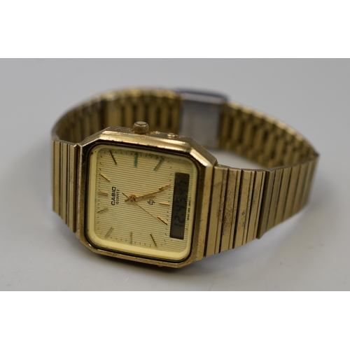 119 - A Casio AQ-331G Gold Tone Digital/Analogue Watch, Working