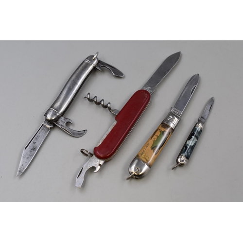 239 - Four Pocket Knifes To Include Ford Model T, Victorinox, And Two Richards Pocket Knives. No Postage