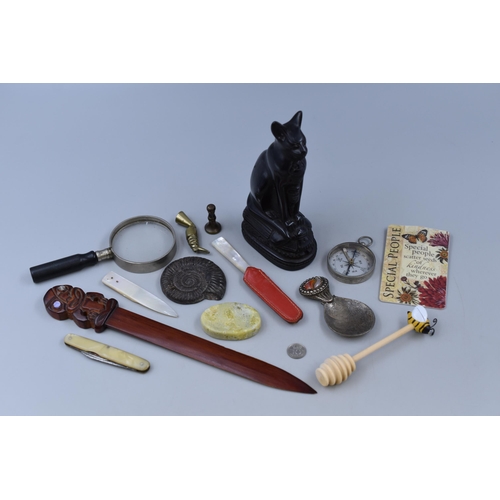 240 - Small mixed items to include 10 cent, Compass, Egyptian Cat Figurine, Mother of Pearl Knife and more