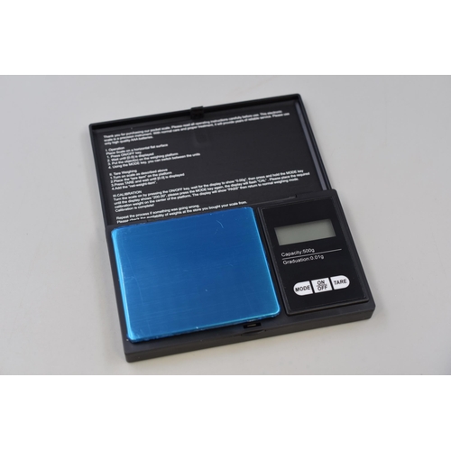 399 - A Set of Digital Pocket Scales With an Eighteen Piece Weight Calibration Set