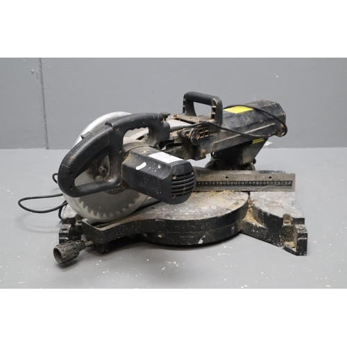 413 - A Wickes 2000W Sliding Mitre Saw, Powers On When Tested But Requires Attention