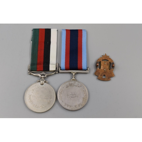 271 - Two Pakistan Medals (1956 Republic / Tamgha War) and a Pakistan Military Badge