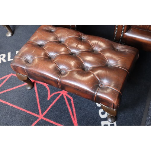 569 - Two Chesterfield Style Brown Leather Wing Backed Studded Arm Chairs with Matching Footstool