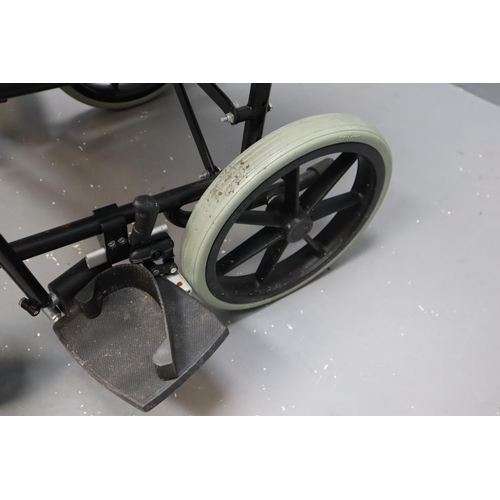 585 - Invacare Ben NG foldable wheelchair with foot rests and cushion