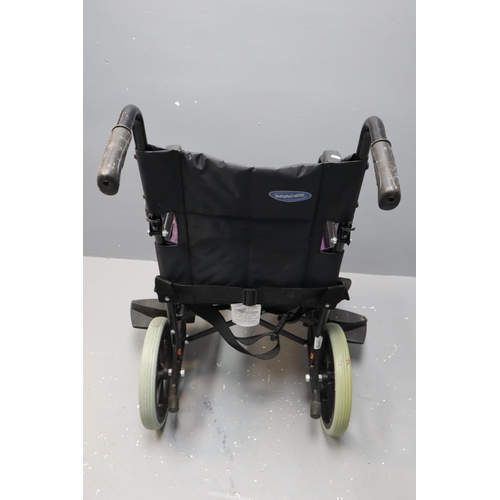 585 - Invacare Ben NG foldable wheelchair with foot rests and cushion