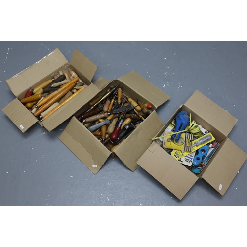 632 - Three boxes of vintage tools to include chizzles, tape measures, nutdriver and more