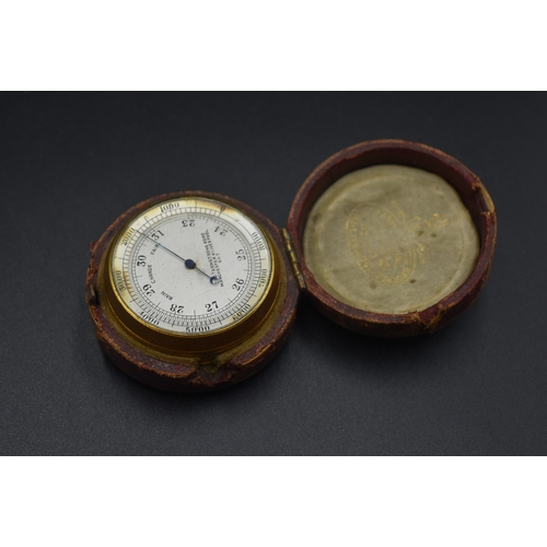 11 - A Thomas Armstrong & Brothers Brass Cased Pocket Barometer, No 263. In Leather Case