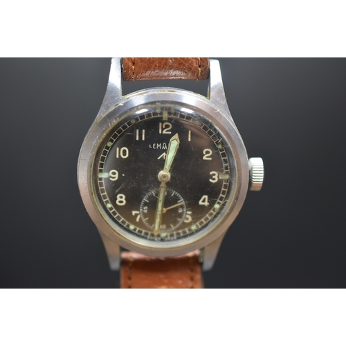 2 - A WWII Military Issue Lemania 'Dirty Dozen' Mechanical Black Dial Watch With Broad Military Arrow an... 