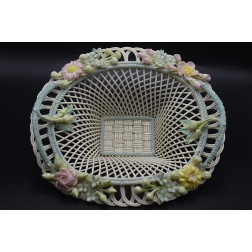 14 - Belleek floral encrusted Basket, the pierced upper rim mounted with flowers lattice and pierced desi... 