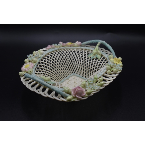 14 - Belleek floral encrusted Basket, the pierced upper rim mounted with flowers lattice and pierced desi... 