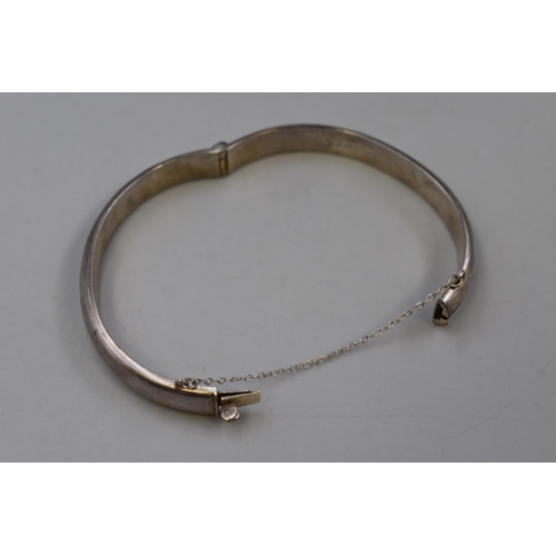 57 - Hallmarked Birmingham Silver Etched Bangle complete with Safety Chain