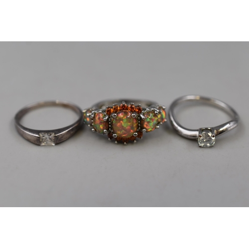 85 - Three 925. Silver Rings, To Include Clear Stoned Solitaire Ring, Opal Effect Stoned Ring, And Other