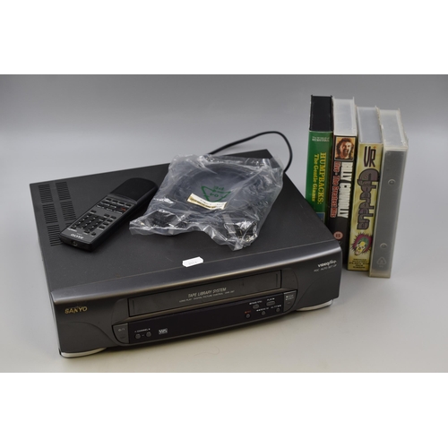 530 - Sanyo VHS with Remote and Four VHS's to include HumpBacks, Billy Connolly Live The Greatest Hits, Cy... 