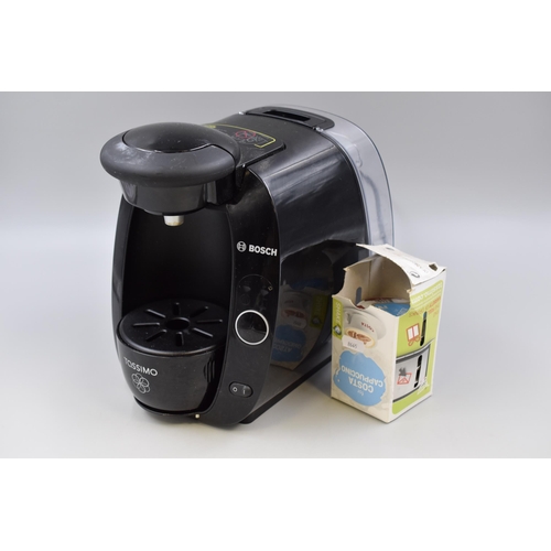 551 - A Bosch Tassimo Coffee Machine With Cappuccino Pods, Powers On When Tested