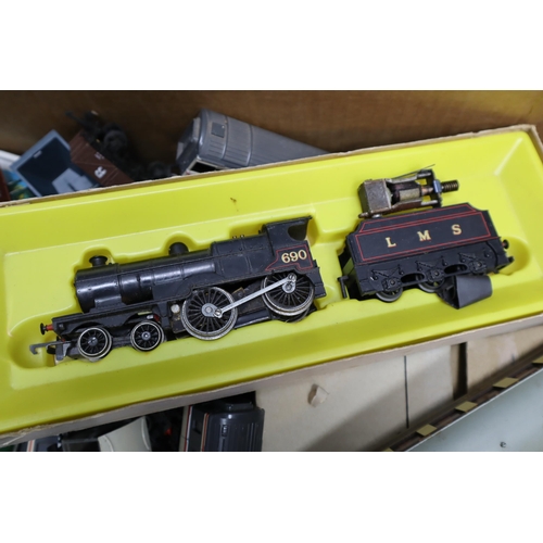 566 - Two mixed Tubs of Vintage Model Railway items to include Train Units, Carriages (some boxed) Outbuil... 