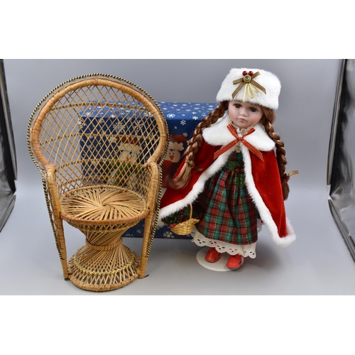 722 - Beautiful Ceramic Christmas China Doll in Gift Box Complete with Stand and Wicker Seat