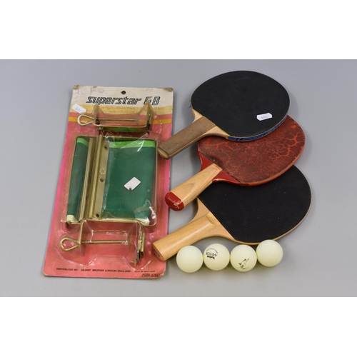 742 - Lot to Include Three Table Tennis Rackets, Table Tennis Balls and Deluxe Nylon Metal Ends Table Tenn... 