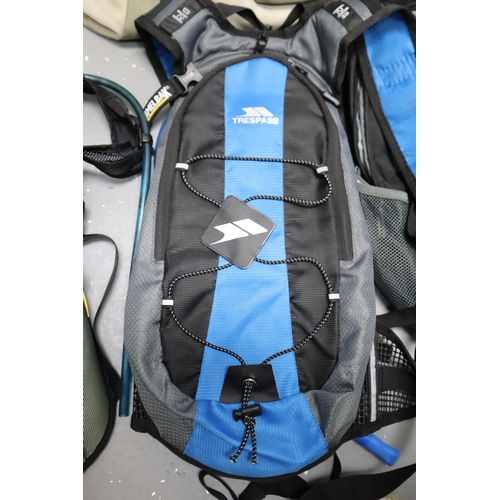 753 - Four Hiking Bags to Include Two Trespass, Camelbak and Reebok with Trespass Thermal Flask