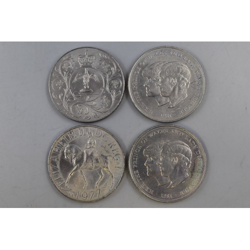 135 - Four Elizabeth II Commemorative Crowns