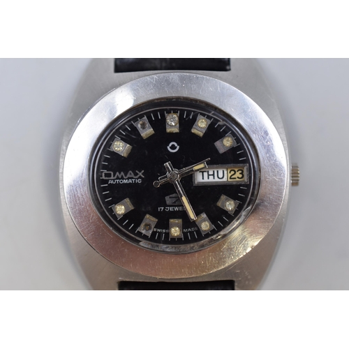 61 - An Omax 7 Automatic 17 Jewels Day/Date Watch, Working. Two Clear Stones Missing From Dial