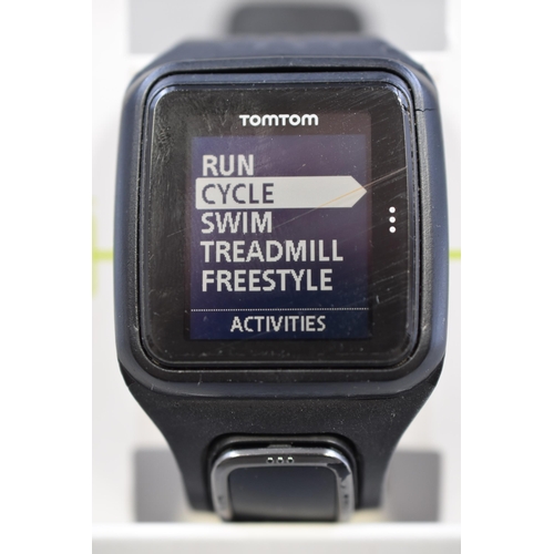 100 - A TomTom Multi-Sport Cardio Watch, With Charger. Working