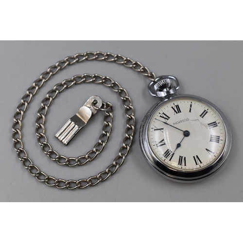 101 - An Ingersoll Pocket Watch With Chain, In Working Order (Damaged Glass)