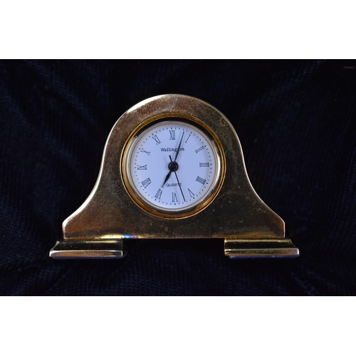 112 - A Zurich Sports Quartz Watch in Presentation Box, With a Miniature Gold Tone Wellington Mantle Clock... 