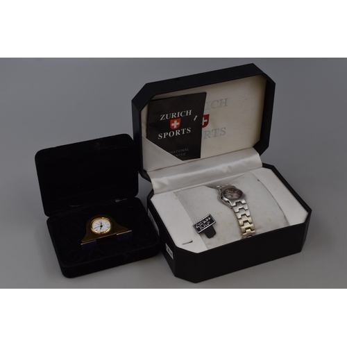 112 - A Zurich Sports Quartz Watch in Presentation Box, With a Miniature Gold Tone Wellington Mantle Clock... 