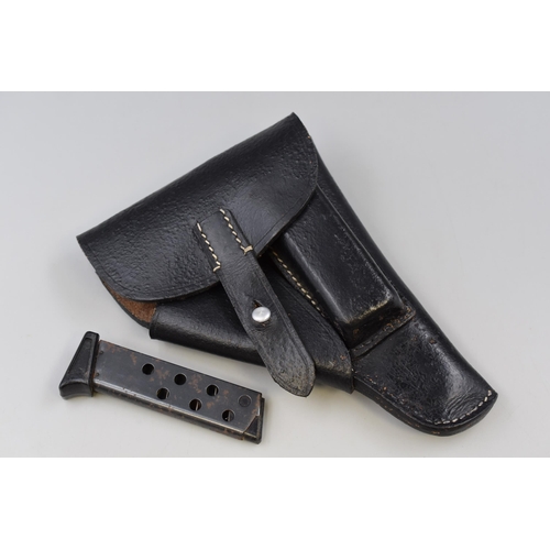 230 - A Leather Pistol Holster, With Magazine Clip