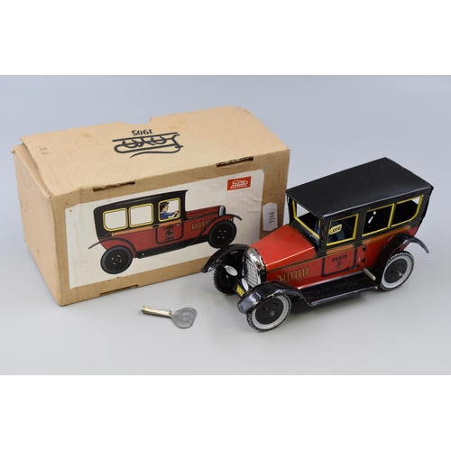 352 - A Boxed Tin Plate Clockwork Vintage Taxi, Working. With Key