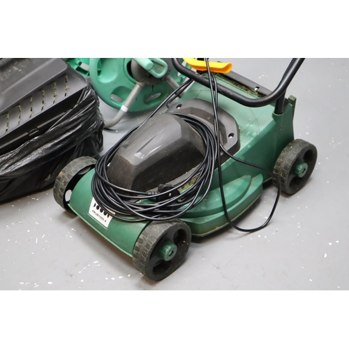 581 - Electric Lawn Mower ( Powers on when tested) with Grass Box and a Hozelock Hose Reel