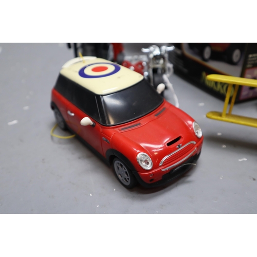 691 - Collection of Various Battery Operated And Remote Controlled 'Nikko' Mini Magnum vehicles, All Untes... 