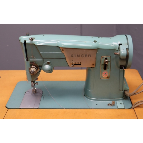 414 - A Vintage Singer 327K Sewing Machine Table, With Instructions and Accessories. Powers On When Tested