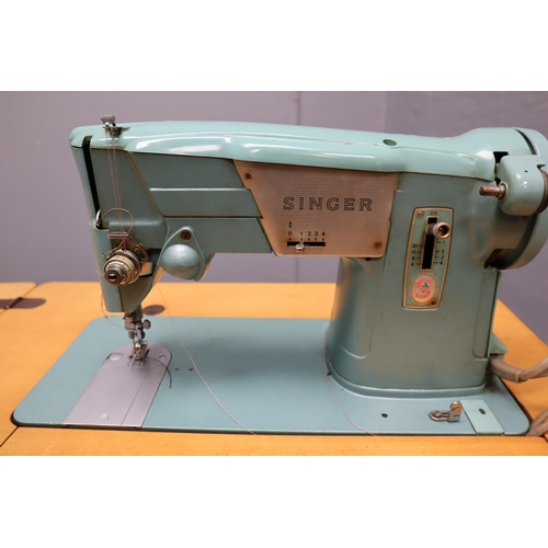 414 - A Vintage Singer 327K Sewing Machine Table, With Instructions and Accessories. Powers On When Tested