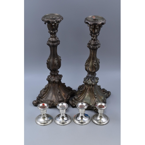 330 - A Pair of Ornate Silver Plated Candlesticks (AF), With A Set of Four Silver Plated Candlesticks. Pai... 